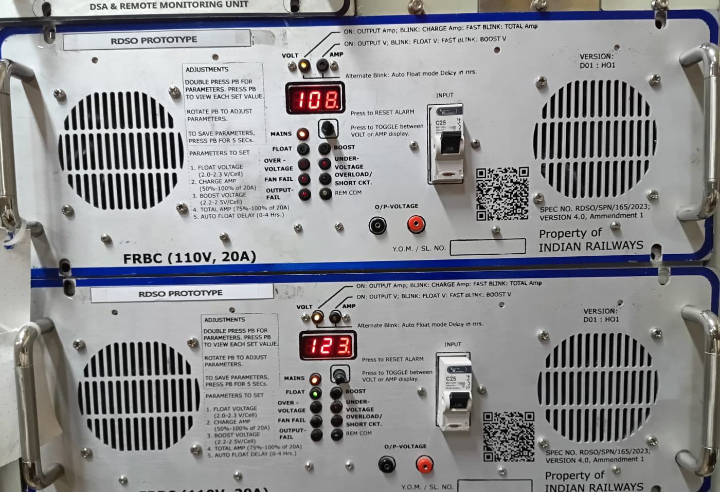 Two stacked FRBC charger faceplates with blue borders, each reading voltage on a red display