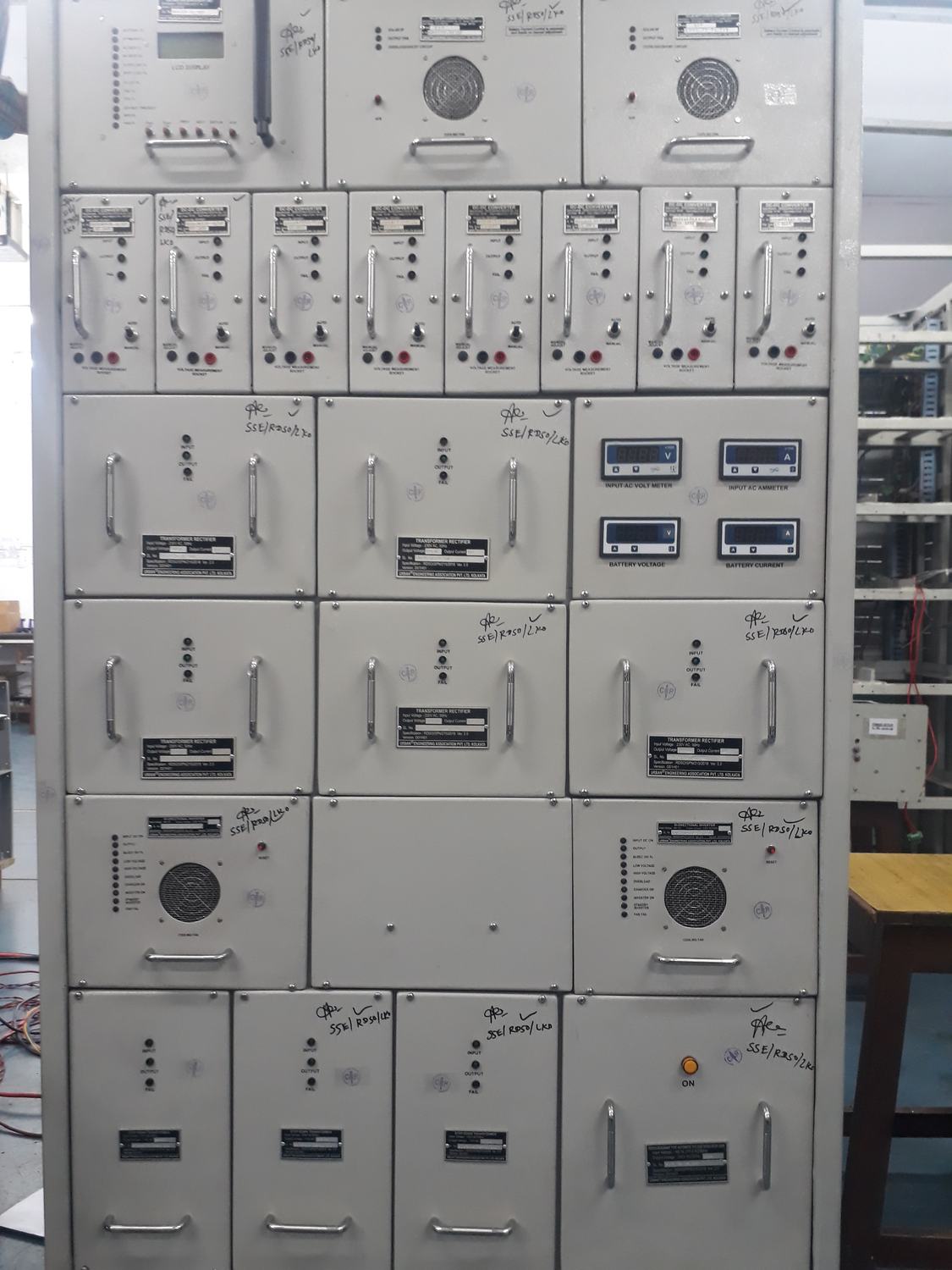 Front of a grey LC gate power supply panel with module rows and meters